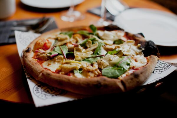 delicious yummy italian pizza at the table at the restaurant, appetizing food photo of italian pizza